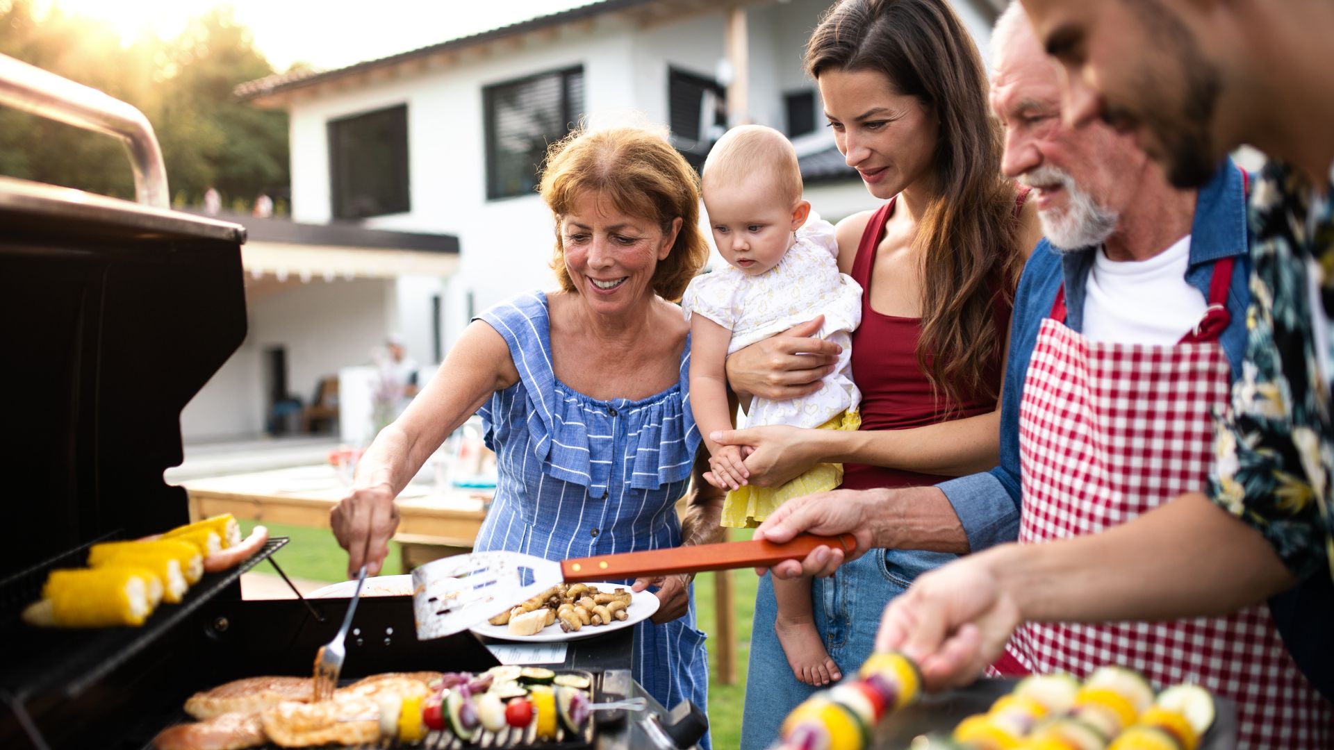 Family grilling in backyard